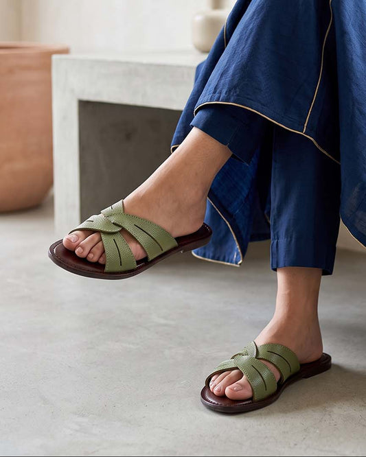 Women's olive green woven crossover strap leather slide flats, on-foot view