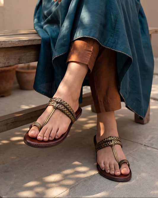 Women's bronze braided strap leather toe-loop flats, on-foot view